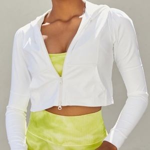 NEW Free People Movement Romance Me Hoodie in White Size Medium. NEW W/O tags.